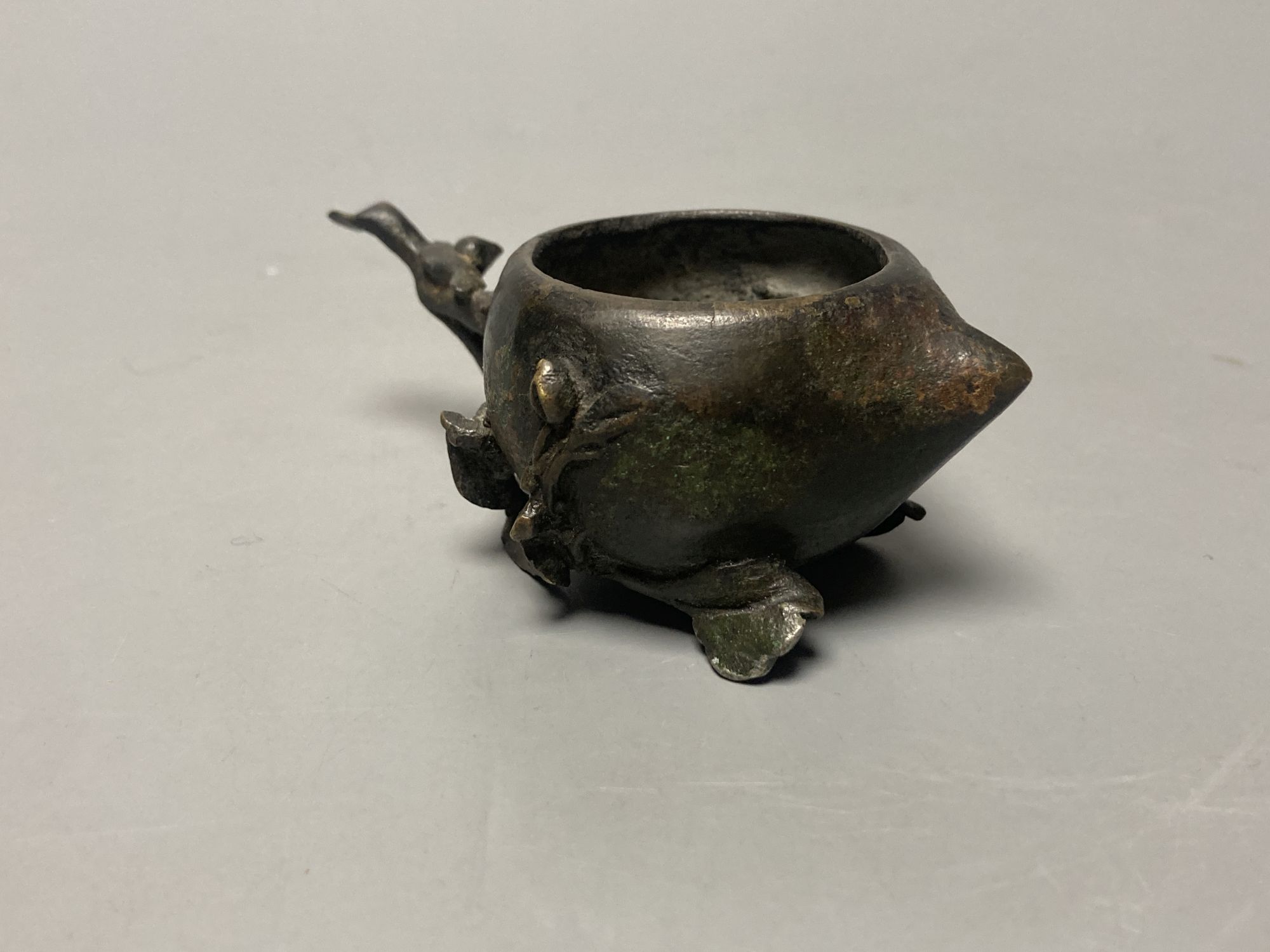 A Chinese Ming bronze peach shaped brush washer, length 9cm